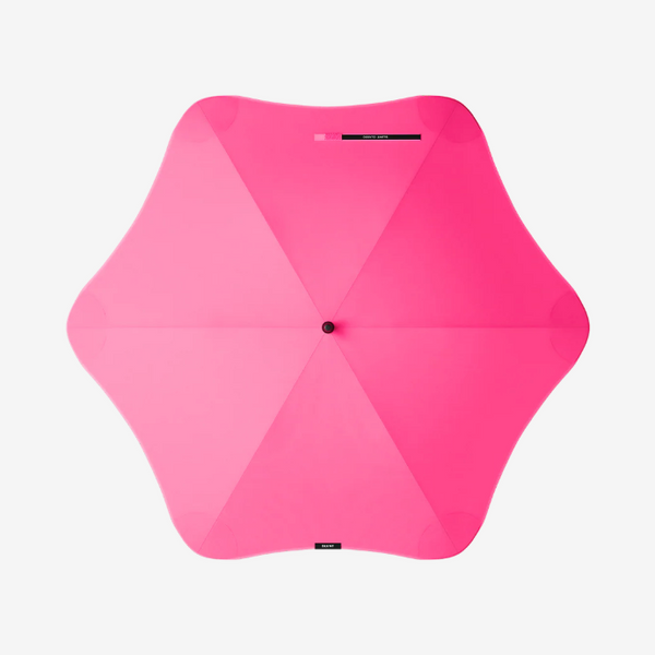 Pink umbrella on a white background